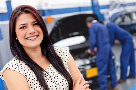 Woman at a car garage getting mechanical service-1